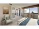 Bright bedroom with a seating area, scenic views, and access to a balcony at 5729 Puerta Del Sol Boulevard South # 486, St Petersburg, FL 33715