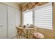 Charming dining area featuring a quaint table setting with a floral tablecloth and bright natural light at 5729 Puerta Del Sol Boulevard South # 486, St Petersburg, FL 33715