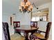 Dining room view into kitchen featuring granite counters and breakfast nook at 5729 Puerta Del Sol Boulevard South # 486, St Petersburg, FL 33715