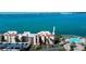 Stunning condo complex featuring red roofs, a refreshing pool, and beautiful ocean views at 5729 Puerta Del Sol Boulevard South # 486, St Petersburg, FL 33715
