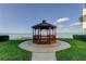 Charming waterfront gazebo on a manicured lawn with scenic views of the bay at 5729 Puerta Del Sol Boulevard South # 486, St Petersburg, FL 33715