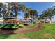 Kayak storage racks with multiple kayaks in a grassy, waterfront community at 5729 Puerta Del Sol Boulevard South # 486, St Petersburg, FL 33715