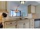 Spacious kitchen with granite counters, stainless steel sink, and ample cabinet space at 5729 Puerta Del Sol Boulevard South # 486, St Petersburg, FL 33715