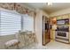 Bright kitchen with stainless steel refrigerator and breakfast nook with table at 5729 Puerta Del Sol Boulevard South # 486, St Petersburg, FL 33715