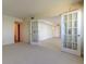 Spacious living room with white french doors leading to other parts of the house at 5729 Puerta Del Sol Boulevard South # 486, St Petersburg, FL 33715