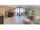 Bright and airy living room with water views, neutral tile, and dining room area at 5729 Puerta Del Sol Boulevard South # 486, St Petersburg, FL 33715