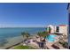 Gorgeous view of the pool, ocean, beach, and surrounding condos at 5729 Puerta Del Sol Boulevard South # 486, St Petersburg, FL 33715