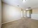 Upstairs living room featuring neutral colored walls, carpet and open floorplan at 5818 Butterfield St, Riverview, FL 33578