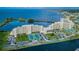 Aerial view of waterfront condominium community with private tennis courts at 5915 Sea Ranch Dr # 403, Hudson, FL 34667