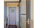 Charming condo entrance with a welcoming wreath and a glimpse into the foyer at 5915 Sea Ranch Dr # 403, Hudson, FL 34667