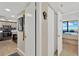 Hallway view leading to kitchen and main bedroom with ocean view at 5915 Sea Ranch Dr # 403, Hudson, FL 34667