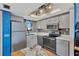 Bright kitchen with modern appliances and tile backsplash at 5915 Sea Ranch Dr # 403, Hudson, FL 34667