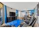 Comfortable living room featuring a large TV and relaxing seating area at 5915 Sea Ranch Dr # 403, Hudson, FL 34667
