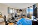 Comfortable living room with leather chairs, a bright rug, and balcony access at 5915 Sea Ranch Dr # 403, Hudson, FL 34667