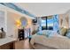 Comfortable bedroom with ocean view balcony, TV, and coastal-themed decorations at 5915 Sea Ranch Dr # 403, Hudson, FL 34667
