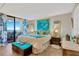 Serene main bedroom with balcony access, coastal decor, and beautiful ocean views at 5915 Sea Ranch Dr # 403, Hudson, FL 34667