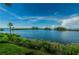 Scenic water view showcasing lush greenery and serene blue waters under a clear sky at 5915 Sea Ranch Dr # 403, Hudson, FL 34667