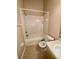 Clean bathroom with a shower-tub combo, white tiled walls, and a vanity sink at 6002 Osprey Lake Cir, Riverview, FL 33578