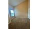 Well lit carpeted bedroom with a window and closet at 6002 Osprey Lake Cir, Riverview, FL 33578