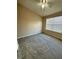 Neutral bedroom with carpet, ceiling fan, and natural light from the window at 6002 Osprey Lake Cir, Riverview, FL 33578