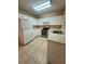 Well-equipped kitchen with tile flooring, stainless steel appliances and white cabinetry at 6002 Osprey Lake Cir, Riverview, FL 33578