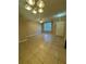 Bright living room featuring tile floors, ceiling fan and a cozy atmosphere at 6002 Osprey Lake Cir, Riverview, FL 33578