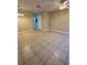 Spacious living room with tile flooring, ceiling fan and neutral paint at 6002 Osprey Lake Cir, Riverview, FL 33578