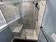 Modern bathroom shower with glass doors, bench, and sleek fixtures at 645 38Th S Ave, St Petersburg, FL 33705