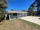 Charming home featuring a covered porch and mature landscaping at 645 38Th S Ave, St Petersburg, FL 33705