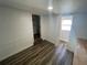 Hallway with wood-look floors connecting to other rooms at 645 38Th S Ave, St Petersburg, FL 33705