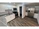 Modern kitchen features stainless steel appliances, granite countertops, and white cabinets at 645 38Th S Ave, St Petersburg, FL 33705