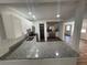 Open kitchen featuring white cabinetry, stainless appliances, granite countertops, and recessed lighting at 645 38Th S Ave, St Petersburg, FL 33705