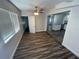 Living room featuring wood flooring and access to other rooms in the home at 645 38Th S Ave, St Petersburg, FL 33705