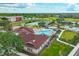 Aerial view of the community amenities, including a pool, tennis courts, playground, and clubhouse at 7708 Nottinghill Sky Dr, Apollo Beach, FL 33572