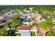 An aerial shot captures a neighborhood scene with houses, trees, and local businesses at 860 17Th S Ave, St Petersburg, FL 33701
