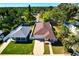 Aerial view of the home showcasing the brown roof, brick driveway, lawns and white fence at 860 17Th S Ave, St Petersburg, FL 33701