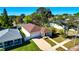 Aerial view of single-Gathering home showing the roof, brick driveway, manicured lawns and white fence at 860 17Th S Ave, St Petersburg, FL 33701