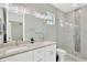 A modern bathroom featuring double sinks and a beautiful walk-in shower at 860 17Th S Ave, St Petersburg, FL 33701