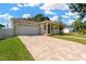 Beautiful home with a brick driveway, attached garage, well-maintained lawn, and inviting front porch at 860 17Th S Ave, St Petersburg, FL 33701