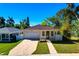 Charming single Gathering home with manicured lawn, brick driveway, and an attached garage at 860 17Th S Ave, St Petersburg, FL 33701