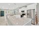 Bright, open kitchen with white cabinets, stainless steel appliances, and a large center island at 860 17Th S Ave, St Petersburg, FL 33701