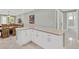 Kitchen island with white cabinets and marble countertop at 860 17Th S Ave, St Petersburg, FL 33701