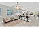 Open-concept living area seamlessly connects seating with a modern kitchen featuring bar stool seating at 860 17Th S Ave, St Petersburg, FL 33701