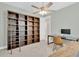 A study with a large bookshelf, a rolling ladder, and a desk with a computer at 860 17Th S Ave, St Petersburg, FL 33701