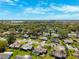 A neighborhood aerial view featuring single Gathering homes and mature trees with a neighborhood park at 8621 Bridgewater Dr, New Port Richey, FL 34655