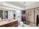 Bathroom featuring a vanity, toilet, and tiled shower-tub, plus a skylight at 8621 Bridgewater Dr, New Port Richey, FL 34655