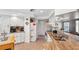 Bright kitchen with granite countertops, white cabinetry, and stainless steel sink at 8621 Bridgewater Dr, New Port Richey, FL 34655