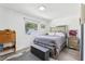 Well-lit bedroom featuring a mirrored headboard and gray wood-look flooring at 1009 Center St, Plant City, FL 33563