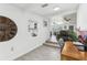 Hallway with view into living room and hardwood style floors, leading into the home at 1009 Center St, Plant City, FL 33563