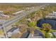 Expansive aerial view showing the property near the highway, pond and surrounding neighborhood at 10423 Carrollbrook Cir # 102, Tampa, FL 33618